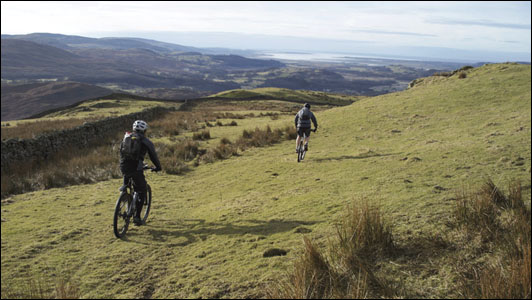 picture of two mountain bikers in the hills